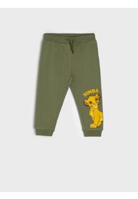 Sinsay - Spodnie Król Lew - khaki. Kolor: brązowy