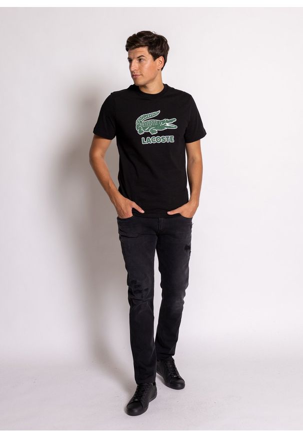 Koszulka męska Lacoste (TH0063-031). Typ kołnierza: polo. Kolor: czarny. Materiał: dzianina. Długość: krótkie. Sezon: lato. Sport: bieganie