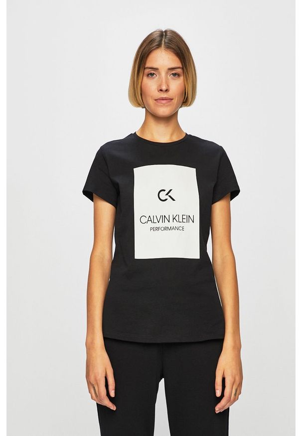 Calvin Klein Performance - Spodnie. Kolor: czarny. Materiał: bawełna, dzianina. Wzór: gładki