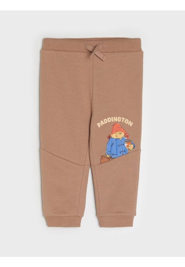 Sinsay - Spodnie jogger Paddington - brązowy. Kolor: brązowy