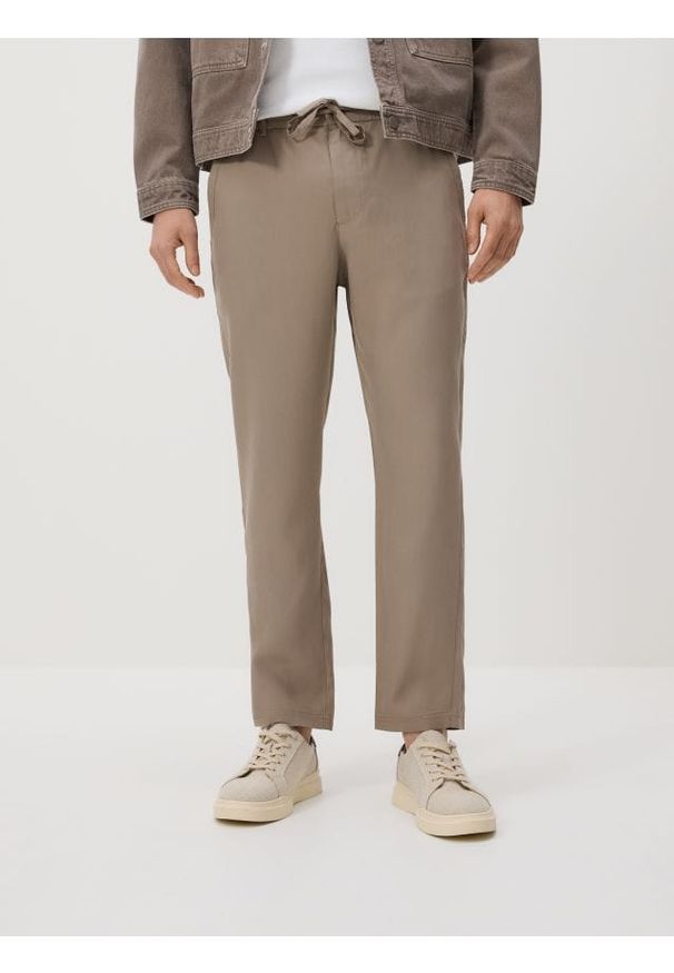 Reserved - Spodnie z lyocellu - brązowy. Kolor: brązowy