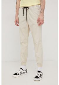 Tom Tailor spodnie męskie kolor beżowy joggery. Kolor: beżowy. Materiał: tkanina, bawełna