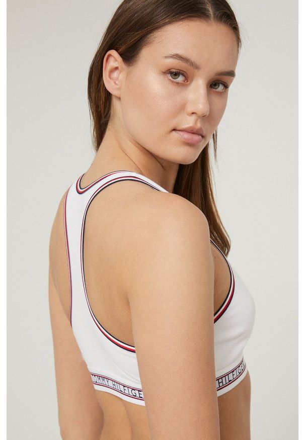 TOMMY HILFIGER - Tommy Hilfiger biustonosz kolor biały gładki. Kolor: biały. Rodzaj stanika: odpinane ramiączka. Wzór: gładki
