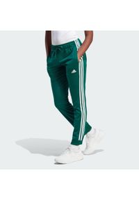 Adidas - Primegreen Essentials Warm-Up Slim Tapered 3-Stripes Track Pants. Kolor: biały, zielony, wielokolorowy. Materiał: dresówka