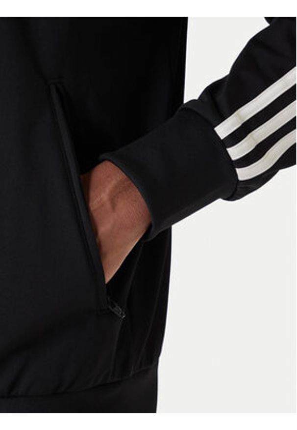 Adidas - adidas Bluza Firebird KD8312 Czarny Loose Fit. Kolor: czarny. Materiał: syntetyk