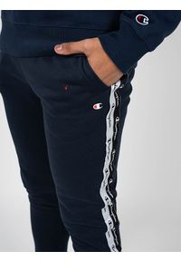 Champion Spodnie "Sweat Pants" | 216561 | Mężczyzna | Granatowy. Okazja: na co dzień. Kolor: niebieski. Materiał: bawełna, poliester. Wzór: nadruk. Styl: casual #5