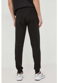Calvin Klein spodnie dresowe kolor czarny gładkie. Kolor: czarny. Materiał: dresówka. Wzór: gładki #3