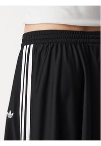 Adidas - adidas Spodnie dresowe Firebird Skirt KR6663 Czarny Relaxed Fit. Kolor: czarny. Materiał: syntetyk #3