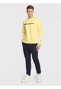 Champion Bluza Embroided Script Logo 217859 Żółty Regular Fit. Kolor: żółty. Materiał: syntetyk