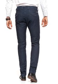 Lee - JEANSY LEE MĘSKIE CHINO HARD BLUE L768HQLG. Wzór: jednolity. Styl: elegancki