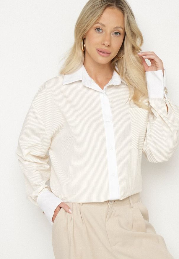 Born2be - Beżowa Koszula Oversize z Wiskozy z Kieszenią i Aplikacjami przy Mankietach Lisavielis. Okazja: na co dzień. Typ kołnierza: kołnierzyk klasyczny. Kolor: beżowy. Materiał: wiskoza. Długość rękawa: długi rękaw. Długość: długie. Wzór: aplikacja. Styl: klasyczny, elegancki, casual