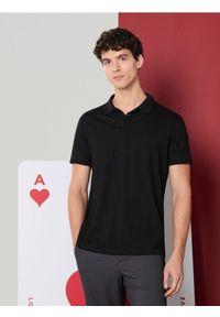Sinsay - Koszulka polo - czarny. Typ kołnierza: polo. Kolor: czarny #1
