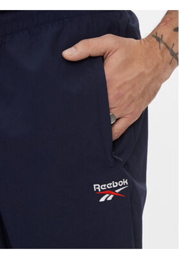 Reebok Spodnie dresowe Classics Vector Tracksuit Bottoms H54439 Niebieski Slim Fit. Kolor: niebieski. Materiał: syntetyk