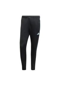 Adidas - Spodnie męskie adidas Tiro 23 Club Training Tracksuit Bottoms. Kolor: niebieski, wielokolorowy, czarny. Materiał: dresówka, materiał