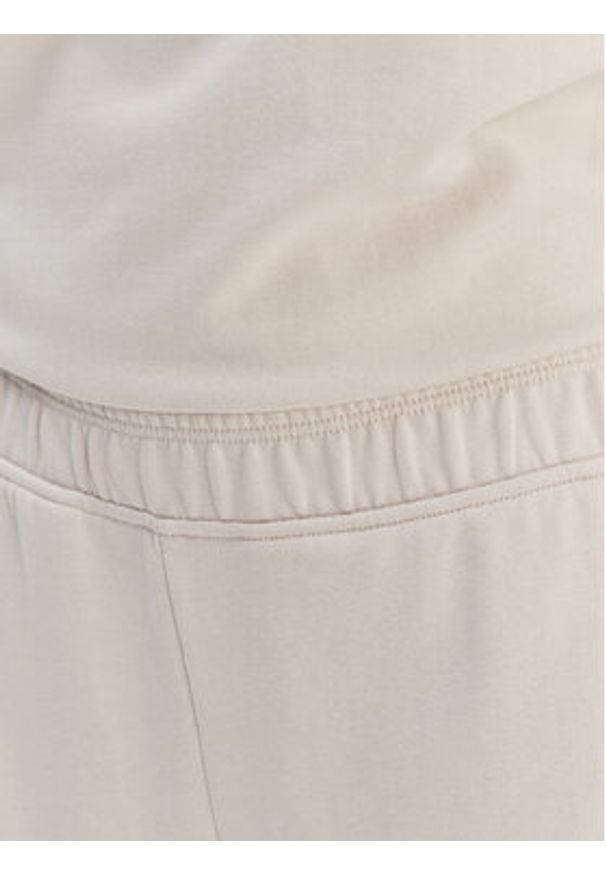 DKNY Sport Spodnie dresowe DP6P3795 Beżowy Regular Fit. Kolor: beżowy. Materiał: bawełna
