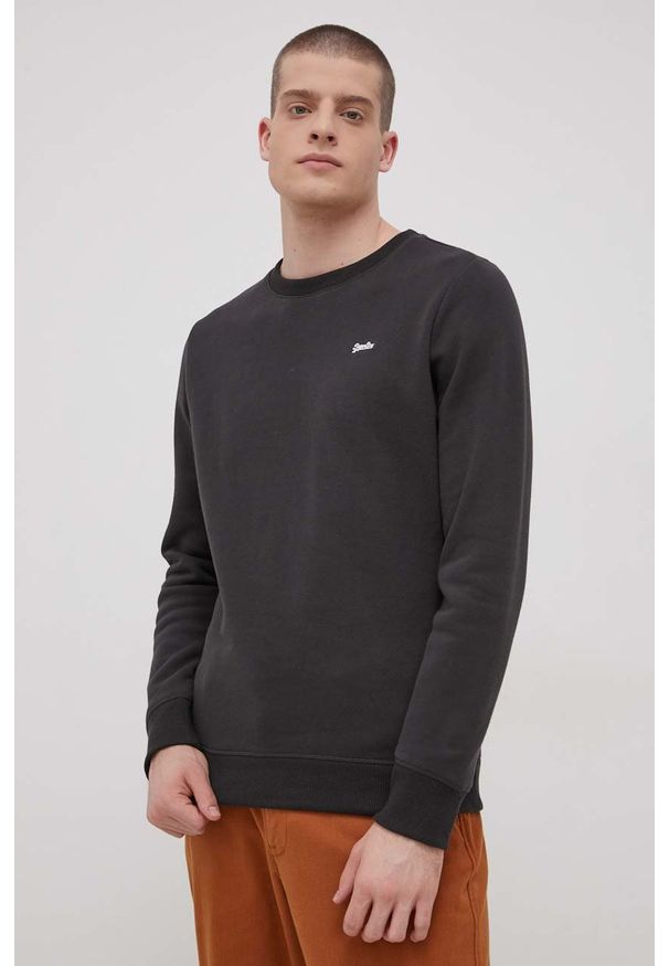 Superdry Bluza męska kolor czarny gładka. Okazja: na co dzień. Kolor: czarny. Materiał: dzianina. Wzór: gładki. Styl: casual