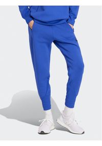 Adidas - adidas Spodnie dresowe Z.N.E. IS3914 Niebieski Regular Fit. Kolor: niebieski. Materiał: bawełna, syntetyk #1