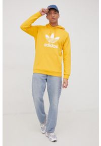adidas Originals bluza bawełniana Adicolor HE9499 męska kolor żółty z kapturem z nadrukiem. Typ kołnierza: kaptur. Kolor: żółty. Materiał: bawełna. Wzór: nadruk #4