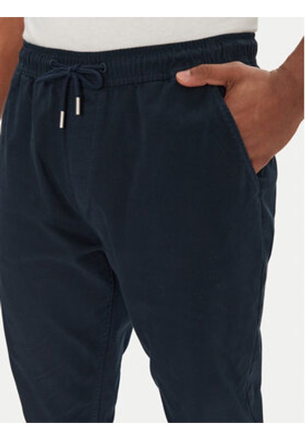 Tommy Jeans Joggery Austin DM0DM20283 Granatowy Slim Fit. Kolor: niebieski. Materiał: bawełna