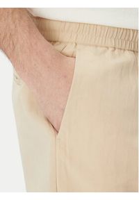 Marciano Guess Spodnie materiałowe 5GHB03 2310Z Beżowy Regular Fit. Kolor: beżowy. Materiał: syntetyk