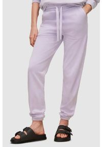 AllSaints spodnie dresowe damskie kolor fioletowy gładkie. Kolor: fioletowy. Materiał: dresówka. Wzór: gładki