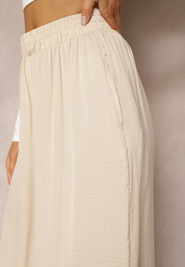 Renee - Beżowe Letnie Spodnie o Szerokim Fasonie z Gumką w Talii Philomen. Kolor: beżowy. Sezon: lato