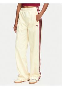 Adidas - adidas Spodnie dresowe Firebird Loose Tracksuit KS4671 Kremowy Loose Fit. Kolor: kremowy. Materiał: syntetyk #1