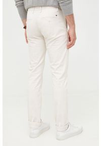 TOMMY HILFIGER - Tommy Hilfiger spodnie męskie kolor beżowy w fasonie chinos. Kolor: beżowy. Materiał: bawełna #4