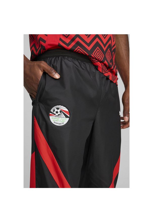 Puma - Męskie spodnie przedmeczowe Egipt PUMA Black Red. Kolor: czerwony, wielokolorowy, czarny. Sport: piłka nożna