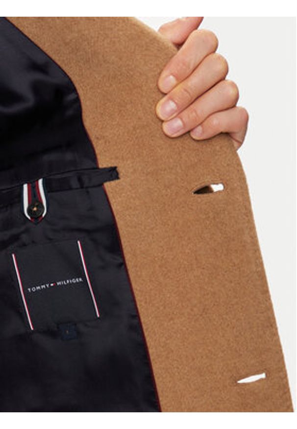 TOMMY HILFIGER - Tommy Hilfiger Płaszcz wełniany MW0MW36611 Beżowy Regular Fit. Kolor: beżowy. Materiał: wełna