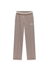Guess Spodnie materiałowe 176829 Brązowy Slim Fit. Kolor: brązowy. Materiał: materiał #2
