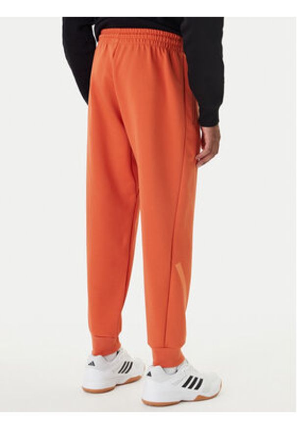 Adidas - adidas Spodnie dresowe Z.N.E. KE4686 Pomarańczowy Regular Fit. Kolor: pomarańczowy. Materiał: bawełna