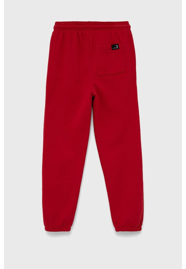 GAP spodnie dziecięce x Disney kolor czerwony z nadrukiem. Kolor: czerwony. Materiał: poliester. Wzór: nadruk, motyw z bajki