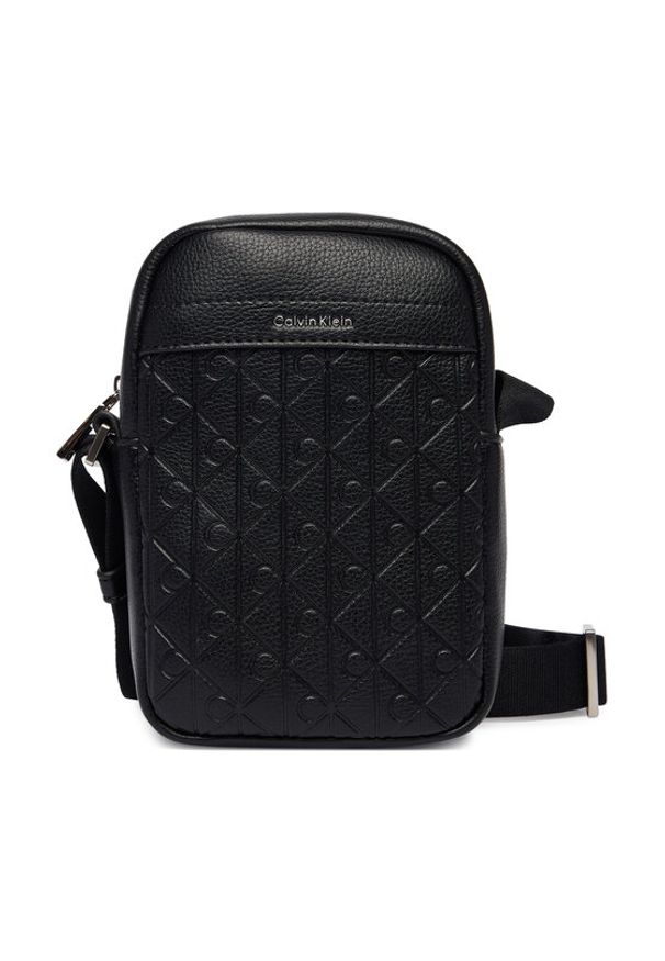 Calvin Klein Saszetka Emblem Aop Emboss Slim Reporter LV04D3228G Czarny. Kolor: czarny. Materiał: skóra