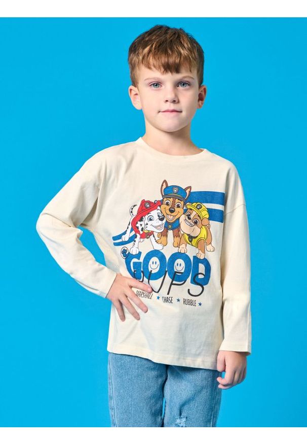 Sinsay - Koszulka z długimi rękawami PAW Patrol - kremowy. Kolor: kremowy. Materiał: bawełna. Długość rękawa: długi rękaw. Długość: długie. Wzór: motyw z bajki
