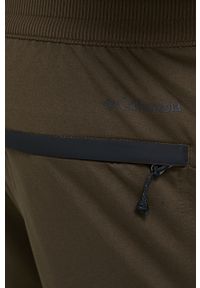 columbia - Columbia spodnie dresowe Tech Trail męskie kolor zielony gładkie. Kolor: zielony. Materiał: dresówka. Wzór: gładki