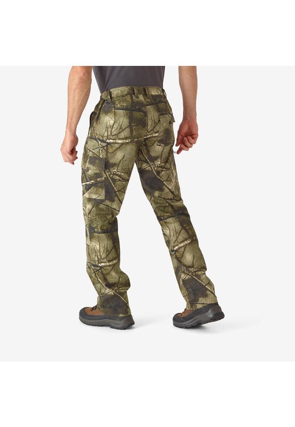 SOLOGNAC - Spodnie myśliwskie Solognac 100 Respi camo treemetic. Kolor: zielony, brązowy, wielokolorowy. Materiał: bawełna, poliester, materiał. Sport: outdoor