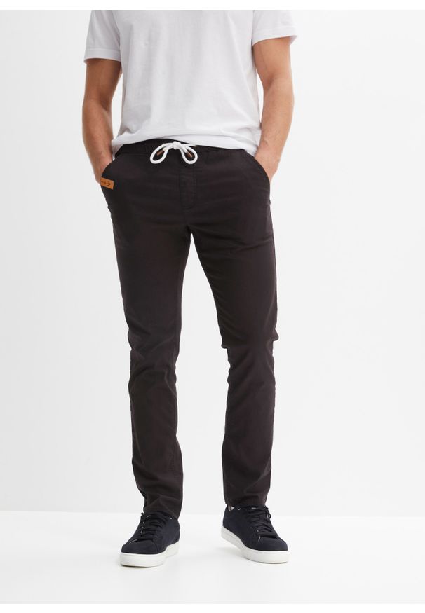 bonprix - Spodnie ze stretchem i gumką w talii, Regular Fit Straight. Kolor: czarny. Materiał: tkanina