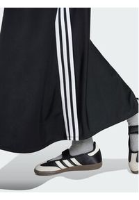 Adidas - adidas Spodnie dresowe Firebird Skirt KR6663 Czarny Relaxed Fit. Kolor: czarny. Materiał: syntetyk #4