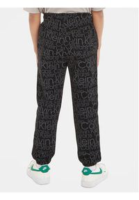 Calvin Klein Jeans Spodnie dresowe Glow In The Dark IB0IB01896 Czarny Regular Fit. Kolor: czarny. Materiał: bawełna