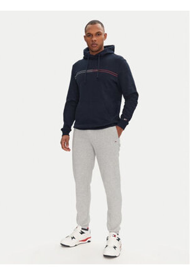 Tommy Jeans Spodnie dresowe Flag DM0DM20473 Szary Slim Fit. Kolor: szary. Materiał: bawełna