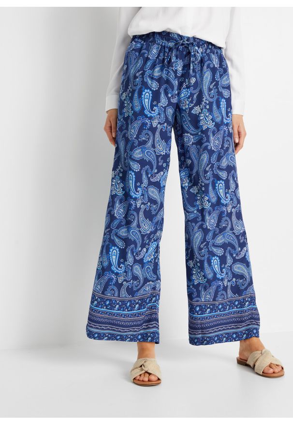 bonprix - Spodnie z szerokimi nogawkami. Kolor: niebieski. Wzór: nadruk, paisley