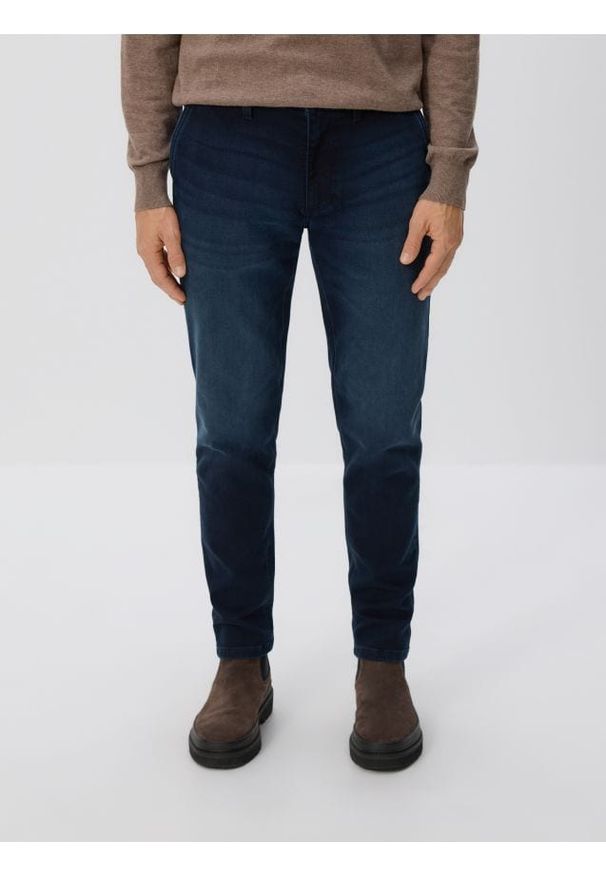 Reserved - Jeansy slim fit z efektem sprania - granatowy. Kolor: niebieski