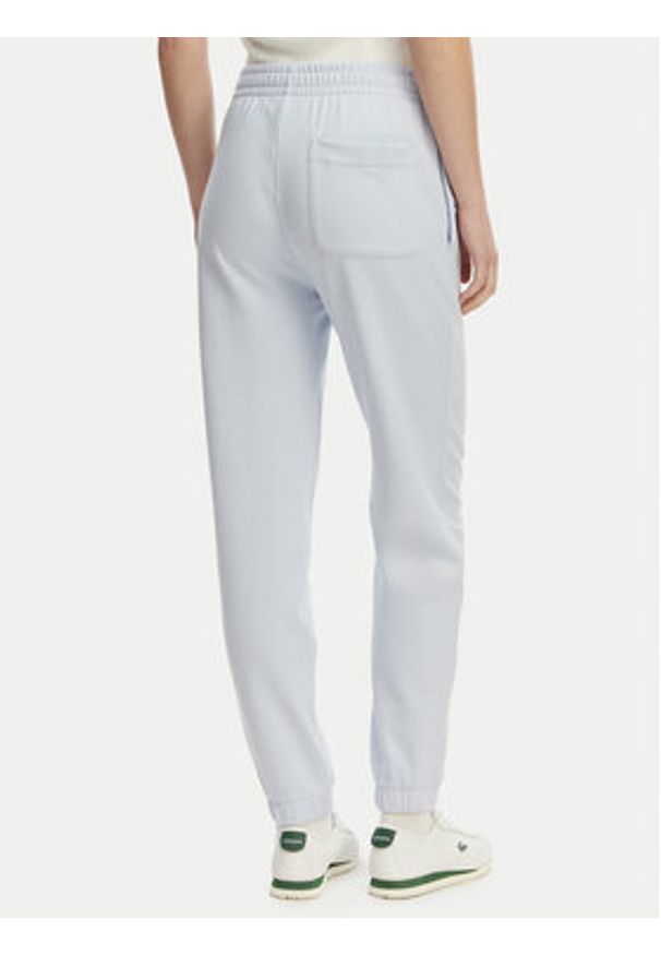 Lacoste Spodnie dresowe XF7604 Niebieski jasny Regular Fit. Kolor: niebieski. Materiał: bawełna
