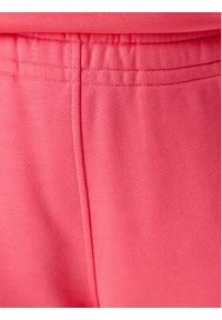 Tommy Jeans Spodnie dresowe Badge DW0DW20679 Różowy Regular Fit. Kolor: różowy. Materiał: bawełna #5