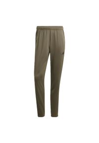 Adidas - Train Essentials 3-Stripes Training Pants. Kolor: zielony, czarny, wielokolorowy. Materiał: materiał, dresówka. Sport: fitness