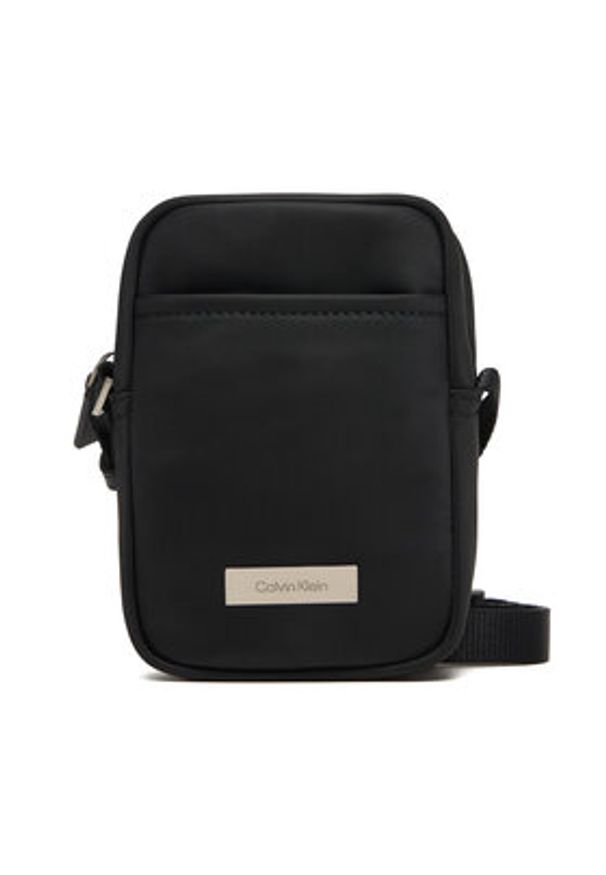 Calvin Klein Saszetka Sleek Slim Reporter LV04D3233G Czarny. Kolor: czarny. Materiał: materiał