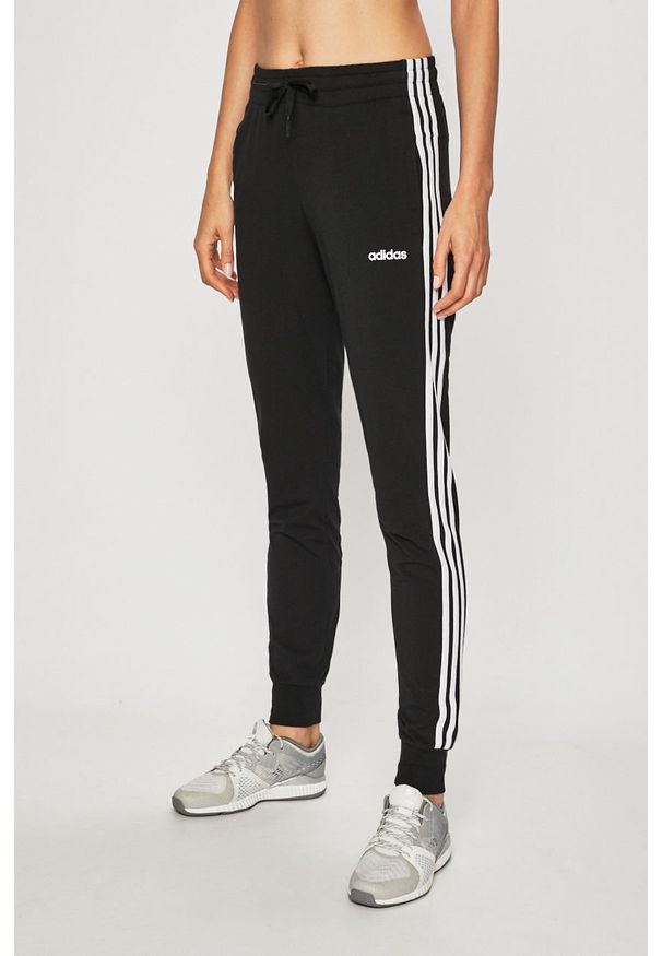 Adidas - adidas - Spodnie. Kolor: czarny. Materiał: bawełna, dzianina. Wzór: gładki
