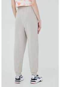 Tommy Jeans spodnie bawełniane dziecięce DW0DW12962.PPYY damskie kolor beżowy gładkie. Kolor: beżowy. Materiał: bawełna. Wzór: gładki #4