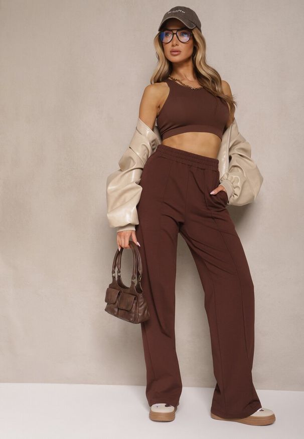 Renee - Brązowe Spodnie Szerokie Pallenassa. Stan: podwyższony. Kolor: brązowy. Materiał: dzianina. Długość: długie